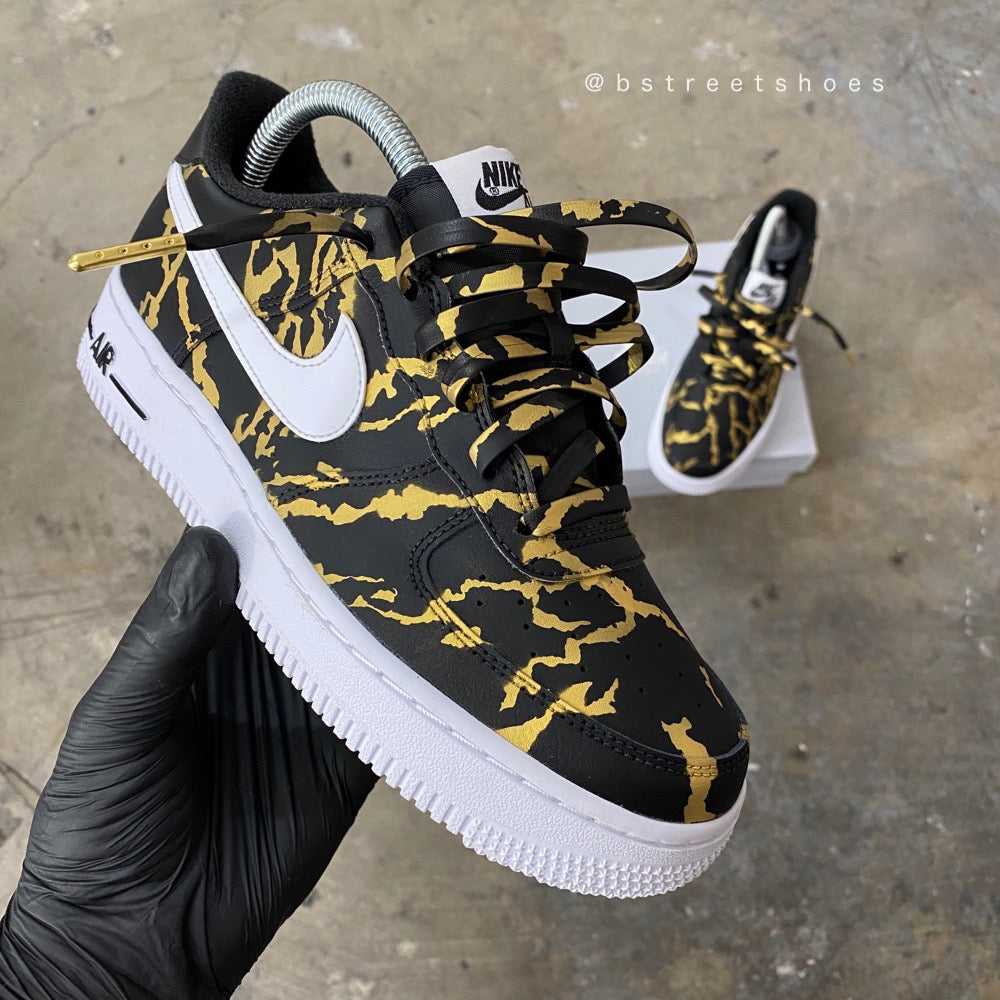 gold and black nike air force 1