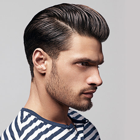 Marcus' longer tapered cut is styled using Hard Water Pomade and a Baxter of California wide-toothed comb, then perfected with a smart side part.