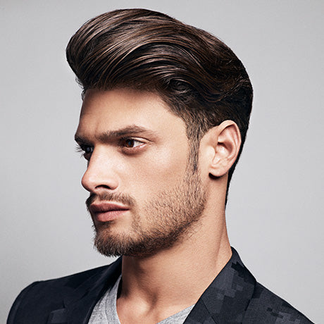 Marcus' classic pompadour is styled into shape with Grooming Lotion and held in place with Hard Water Pomade.