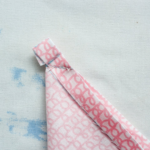 sew a mitered corner on a wide double fold hem