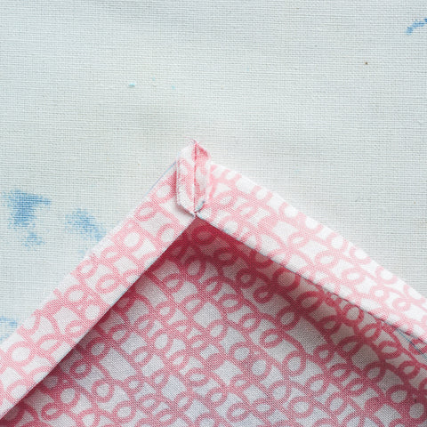 sew a mitered corner on a double fold hem