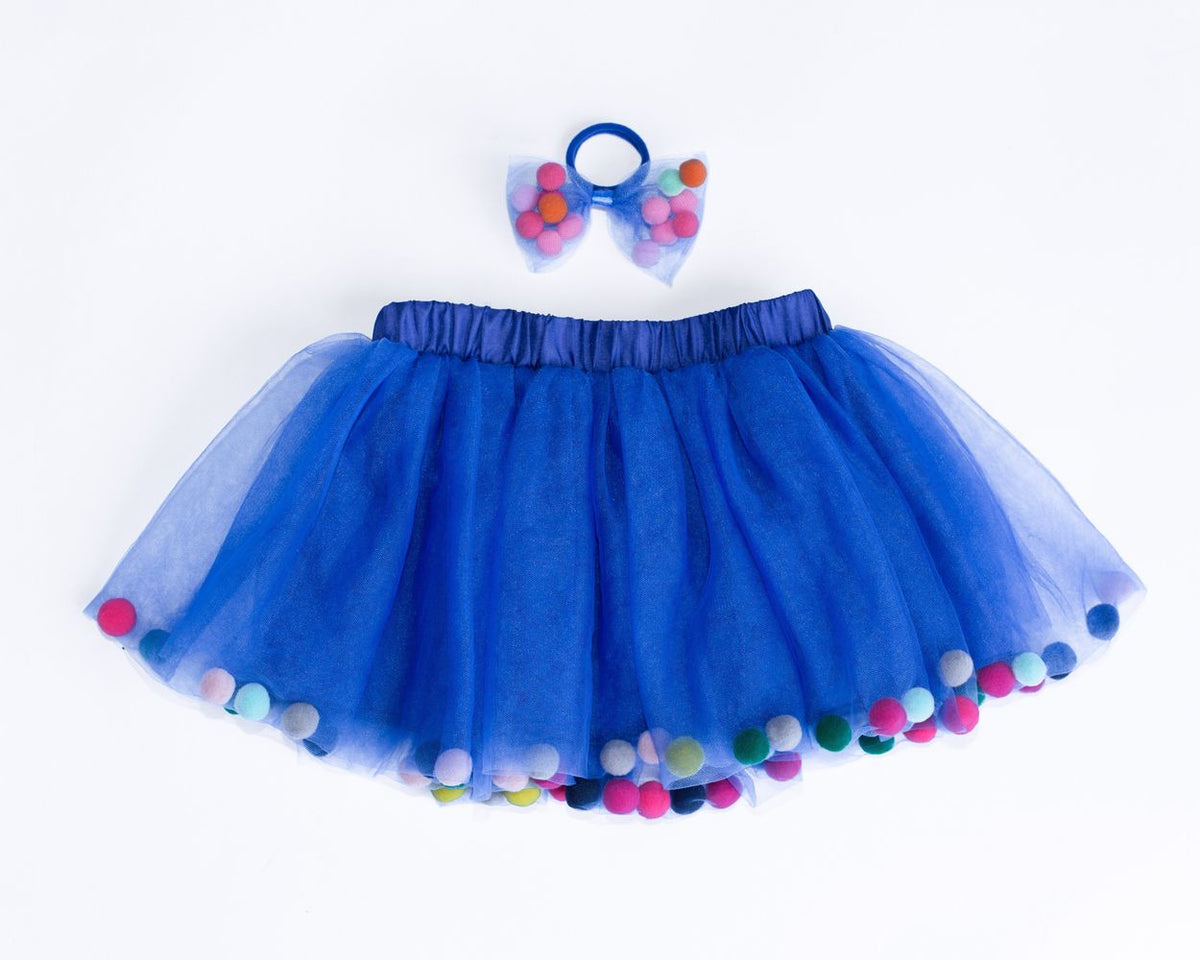 blue skirt with pom poms