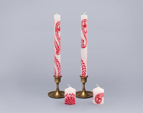 Henna red on white taper candles and votive candles