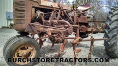 Farmall C tractor with C254  cultivator front left