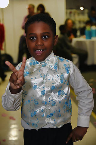 Young boy modelling a Boy's print vest