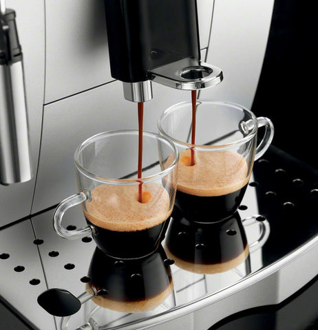 coffee being dispensed by a superautomatic erspresoo machine