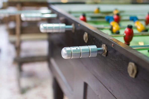 A close-up of a popular outdoor foosball table. 