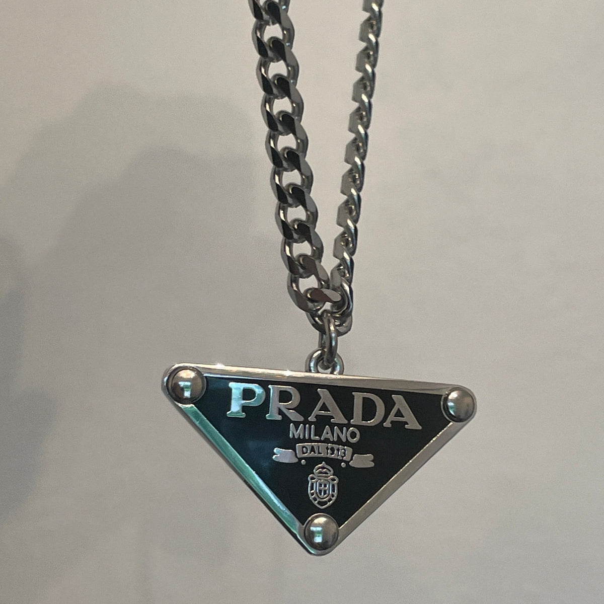 black triangle prada necklace