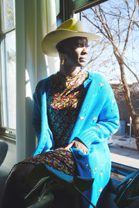Diamond Mahone in our Multi Daisy Lettuce Edge Long Dress and Hand Embroidered Cardigan.