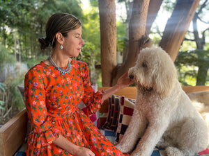 Irene Neuwirth in Jonathan Cohen FW21 with her dog, Miguel.