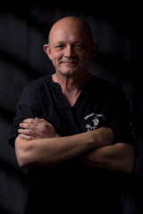 picture of Chris Newson with arms folded