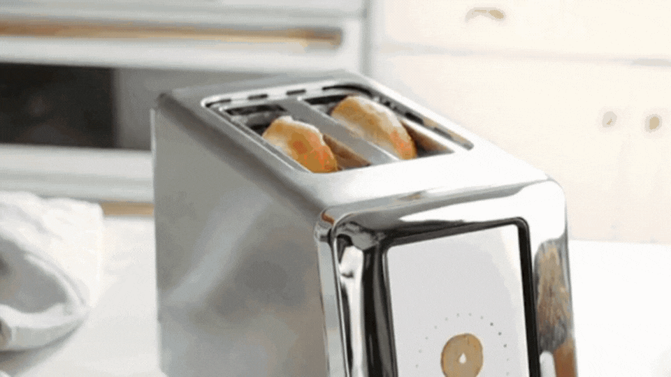 gif of bread lowering into toaster and showing the install lights turn on as it goes black around. shows the food inside getting toasted