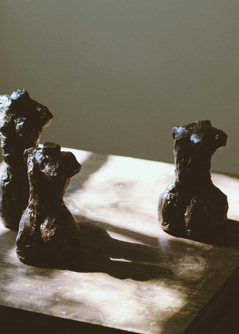 A cold cast bronze sculpture of a female body&#039;s twisted torso and thighs.