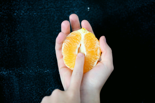 An orange used to represent a vaginal opening