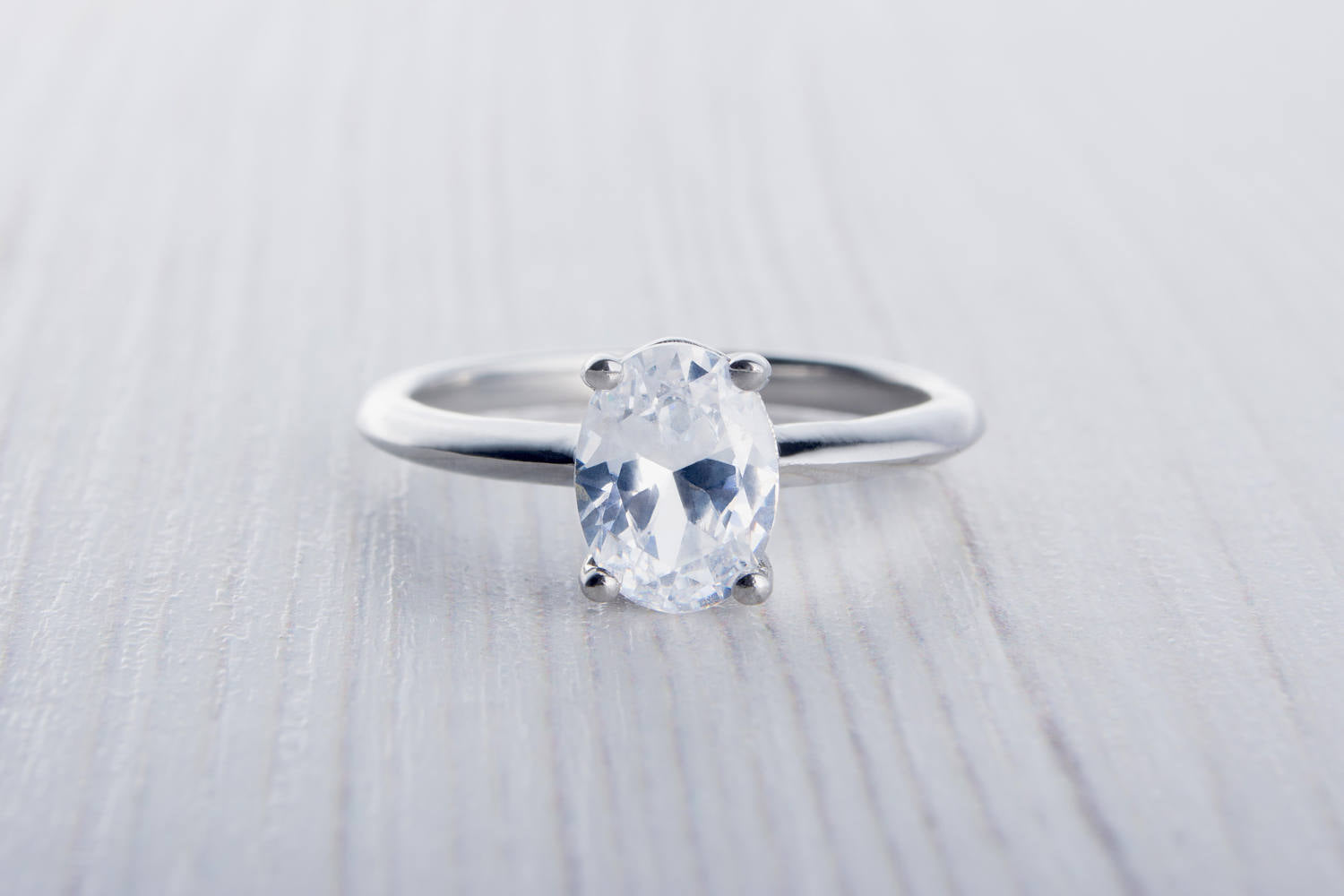 oval man made diamond engagement ring