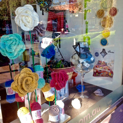 Crochet flowers in Crumbz Craft's window