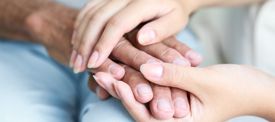 Comforting hands holding hands of another person