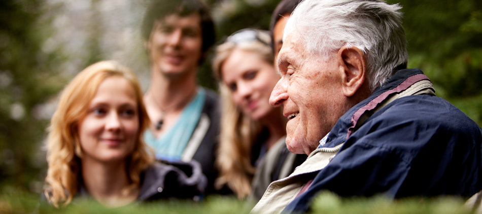 Grandchildren Surrounding Their Grandfather