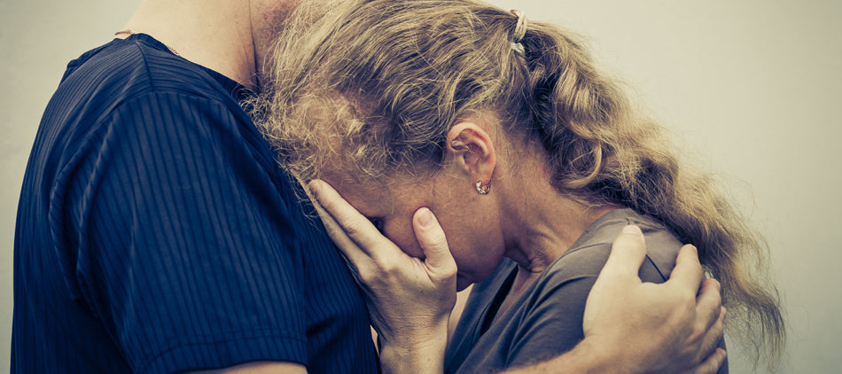 Person Comforting a Crying Woman