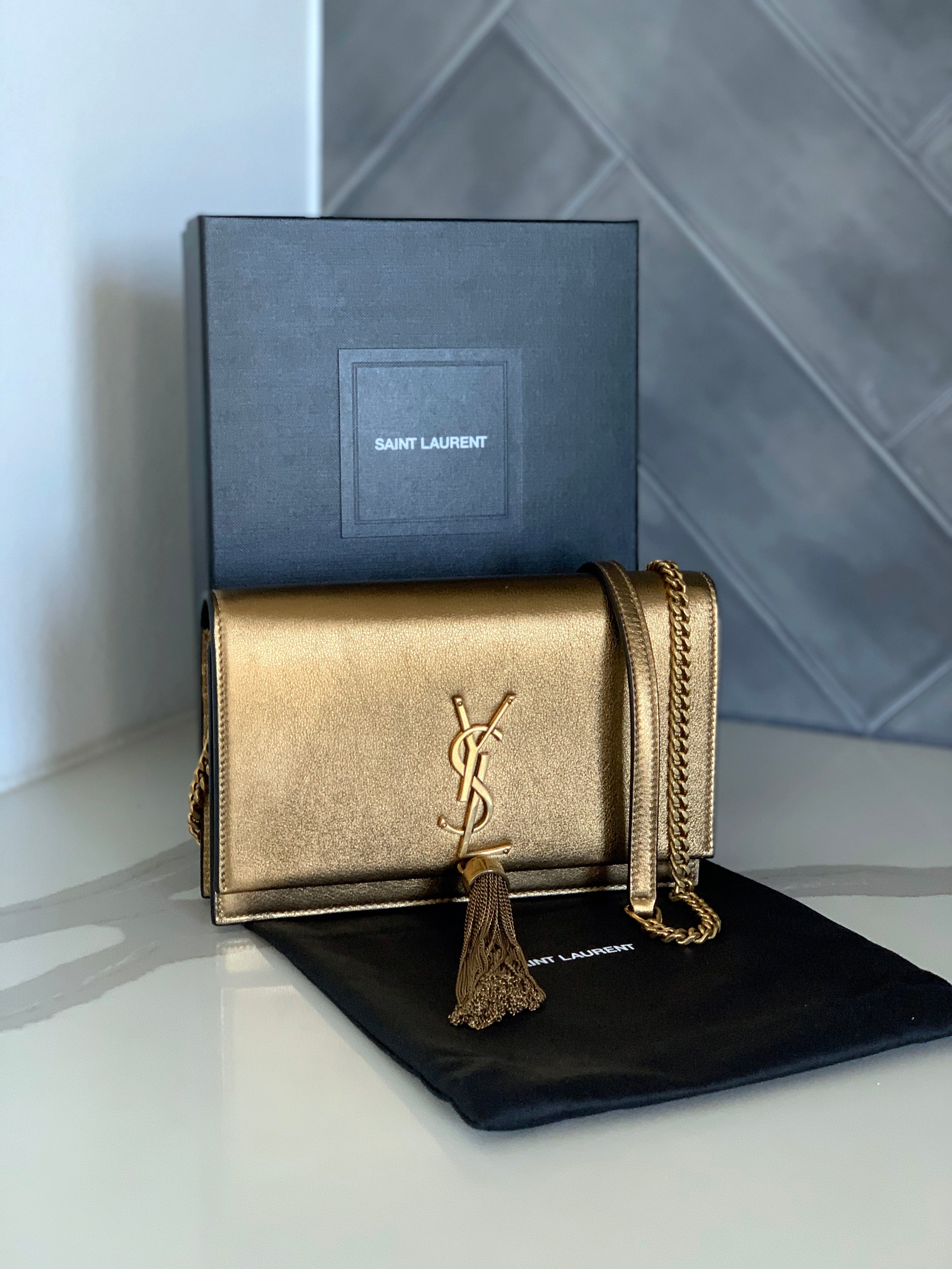 ysl gold tassel bag