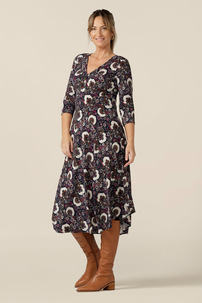 A great dress for 40 plus women, this 3/4 sleeve empire line dress with twist front bodice and dipped, calf length hem is shown here in a size 10. Australian-made by Australian and New Zealand women's clothing brand, L&F this paisley print jersey dress is available to shop in sizes 8 to 24.