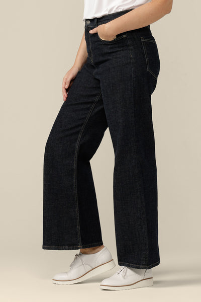 High-waisted, flared leg jeans in midnight denim, size 12, side view. Ethically and sustainably made by Australian and New Zealand women's clothing brand, L&F.