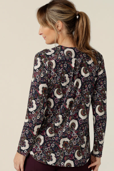 Back view of a long-sleeve, V-neck top in paisley print jersey for women in a size 10. Made in Australia by Australian and New Zealand women's clothing company, L&F this tailored work top is available to shop in sizes 8 to 24.