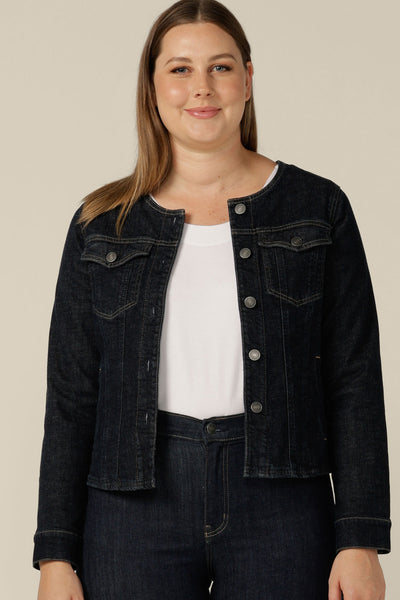 A collarless denim jacket in size 12 is worn with white bamboo jersey T-shirt and super-stretch skinny jeans. Ethically made in partnership with Outland Denim, this denim jacket is tailored to fit women in sizes 8 to 24 by Australian and New Zealand women's clothing label, L&F.