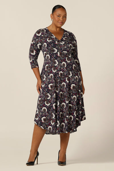 Create professional presence in this calf length, jersey work dress by L&F Australia. A 3/4 sleeve, empire line dress with twist front bodice ad dipped, calf length hem this well-fitting dress is Australian-made and is available to shop in sizes 8 to 24.