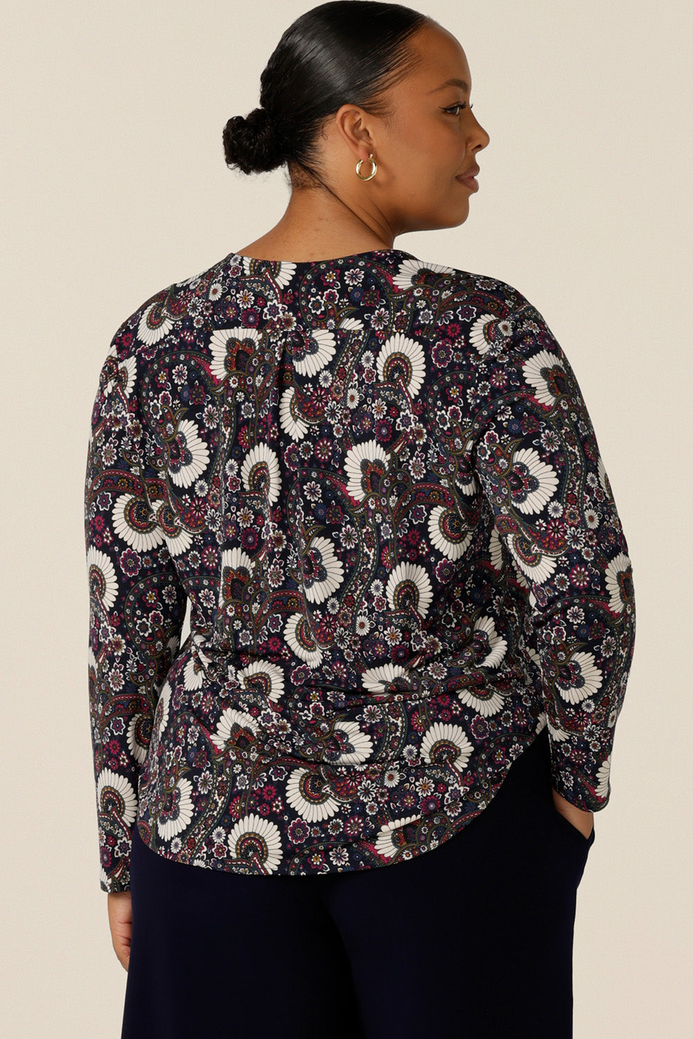 Back view of a long-sleeve, V-neck top in paisley print jersey, for size 18 women. Made in Australia by Australian and New Zealand women's clothing label, L&F this is a great top for work and is available to shop in sizes 8 to 24.