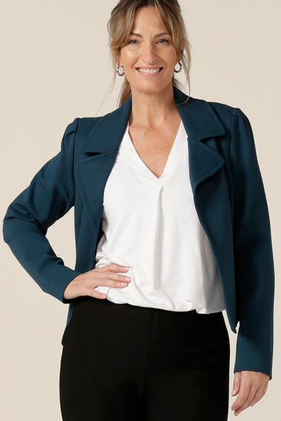 Model wears the Garcia Jacket in Petrol ponte fabric by Australian and New Zealand women's clothing brand, L&F. Featuring collar and notch lapels and long sleeves, this open-fronted jacket is good for corporate wear and casual wear.