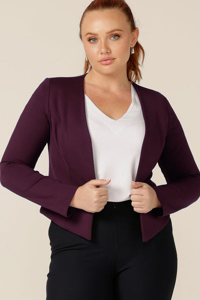 A good workwear jacket, the Mackenzie Jacket in Mulberry by Australian and New Zealand women's clothing label, L&F is a collarless, open front jacket with long sleeves and an angled hem. Made in Australia, shop this corporate wear jacket in an inclusive size range of 8 to 24. 