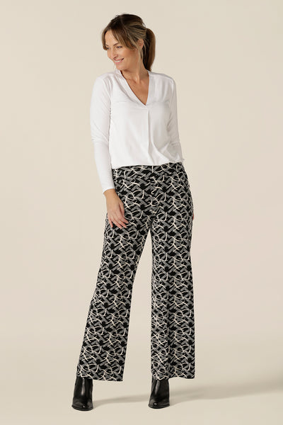 A great top for work or casual wear, this long sleeve, V-neck top in white bamboo is a clothing essential that will match with your capsule wardrobes. Worn with wide leg, black and white print pants, both are made in Australia by Australian and New Zealand women's clothing brand, L&F.