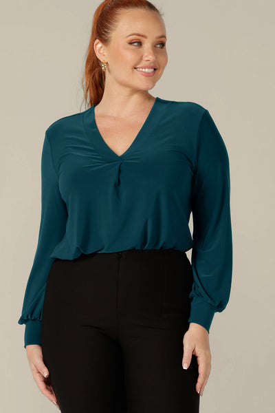 Long sleeve, V-neck top in dark teal jersey, size 12 by Australian and New Zealand women's clothing company, L&F.