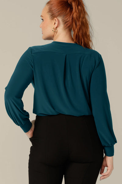 Back view of a long sleeve, V-neck top in dark teal jersey, size 12 by Australian and New Zealand women's clothing brand, L&F.