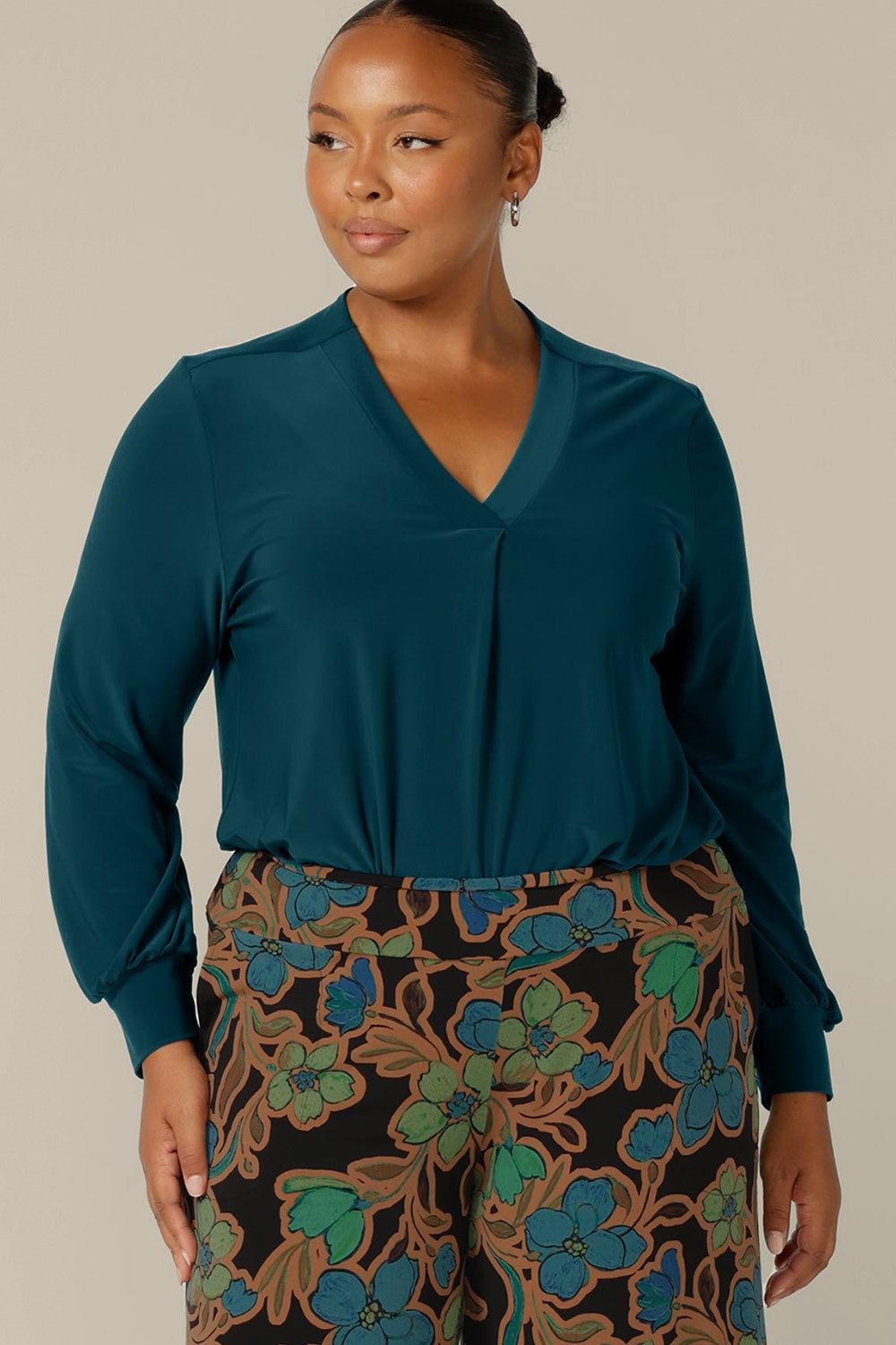 Long sleeve, V-neck top in dark teal jersey, size 12 by Australian and New Zealand women's clothing company, L&F. Available to shop in sizes 8 to 24.