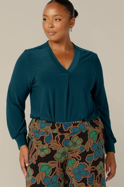 Long sleeve, V-neck top in dark teal jersey, size 12 by Australian and New Zealand women's clothing company, L&F. Available to shop in sizes 8 to 24.