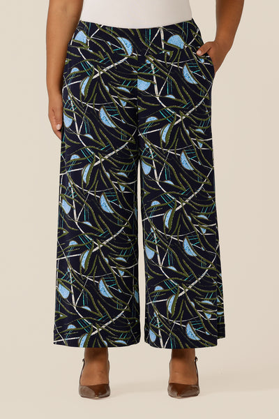 Australian-made, wide-leg pants in a size 18 by Australian and New Zealand women's clothing label, L&F. Featuring a blue, green and white abstract print on navy-base jersey, these stretch-fit wide leg trousers wear well for work or casual wear. Shop pants in inclusive sizes now.