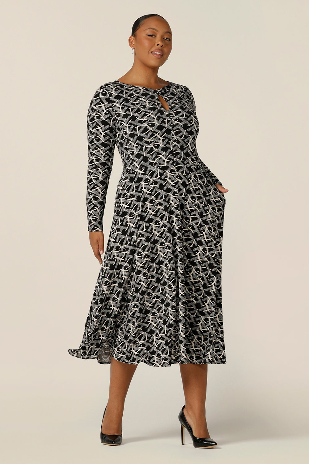 A good dress for plus size, fuller figure women, the Sandee Dress in Thornbirds by Australian and New Zealand women's clothing company L&F is well-fitting in a stretch knit fabric. A midi length, long sleeve dress with twisted keyhole detail, this is an Australian-made dress available to buy in an inclusive size range of 8 to 24.