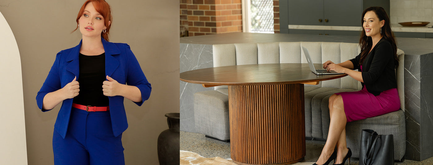 2 women wearing back-to-work style outfits. One woman wears a tailored jacket and high-waisted wide leg cropped pants in cobalt blue styled with a black jersey top. The other woman wears a fixed wrap jersey dress in fuchsia pink with a softly tailored black jacket. She sits at a table with a laptop to suggest working from home or office an situation where her clothing needs to be professional and business-like.