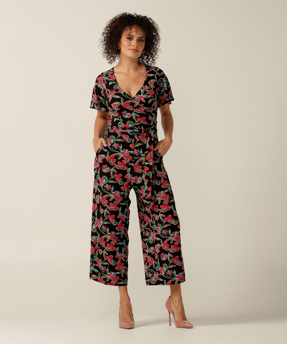 Wrap-front stretch jersey jumpsuit with short flutter sleeves and wide cropped legs. Featuring an exclusive colourful floral print, this jumpsuit is made in Australia for plus size women, petite women and women looking to build a capsule wardrobe.