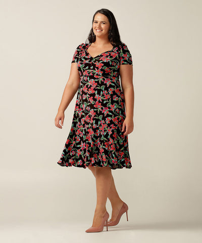 the Jillian Dress is a summer dress with sweetheart neckline and deep ruffle hem. Designer fashion, she features en exclusive floral print and is made in Australia by fit experts, Leina and Fleur for plus size women, petite sizes and fashion-conscious women building capsule wardrobes for work and travel