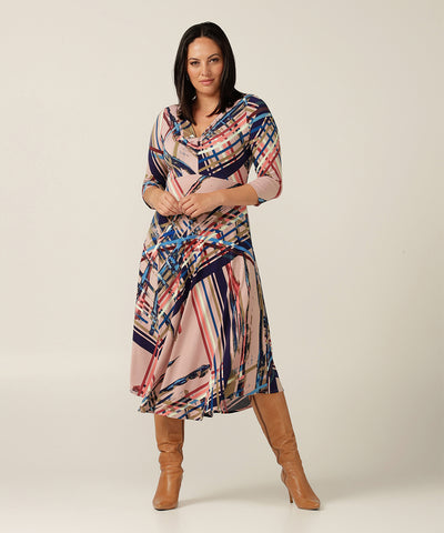 Empire line dress with twist bodice and dipped hem.