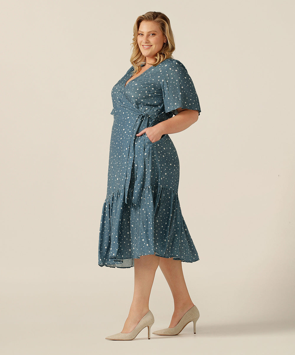 tailored wrap dress with pockets made from breathable fabric.