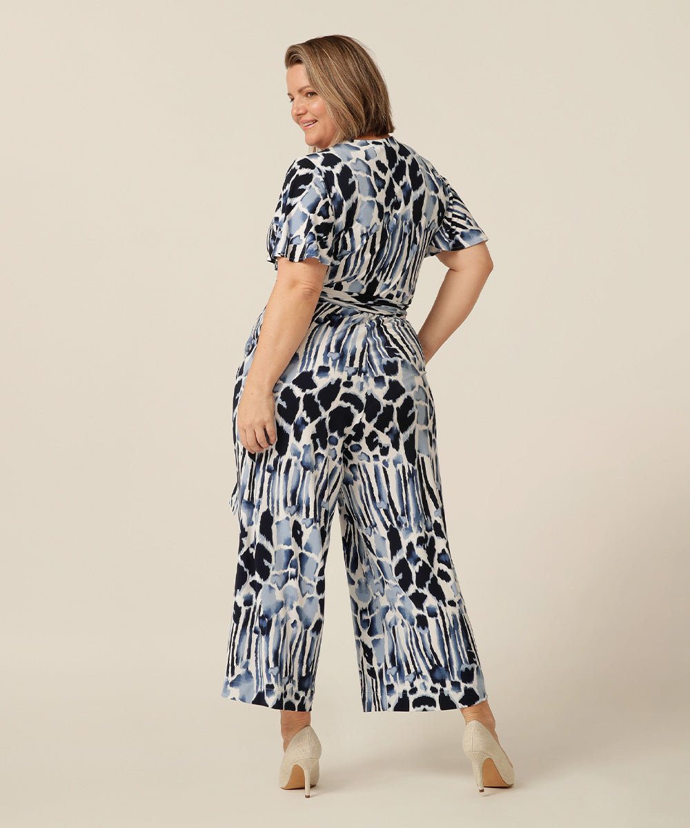 jersey jumpsuit with flutter sleeves, wrap bodice and cropped length. Made in Australia for petite to plus size women.  Blanca Jumpsuit in Sumi | elarroyoenterprises Jumpsuits for Work & Outings
