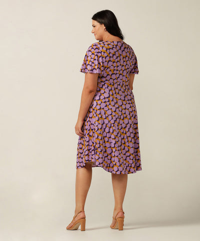 twist front, empire line short dress with flutter sleeve. Made in Australia for plus size women, petite sizes and women looking for evening, occasionwear and party dresses.