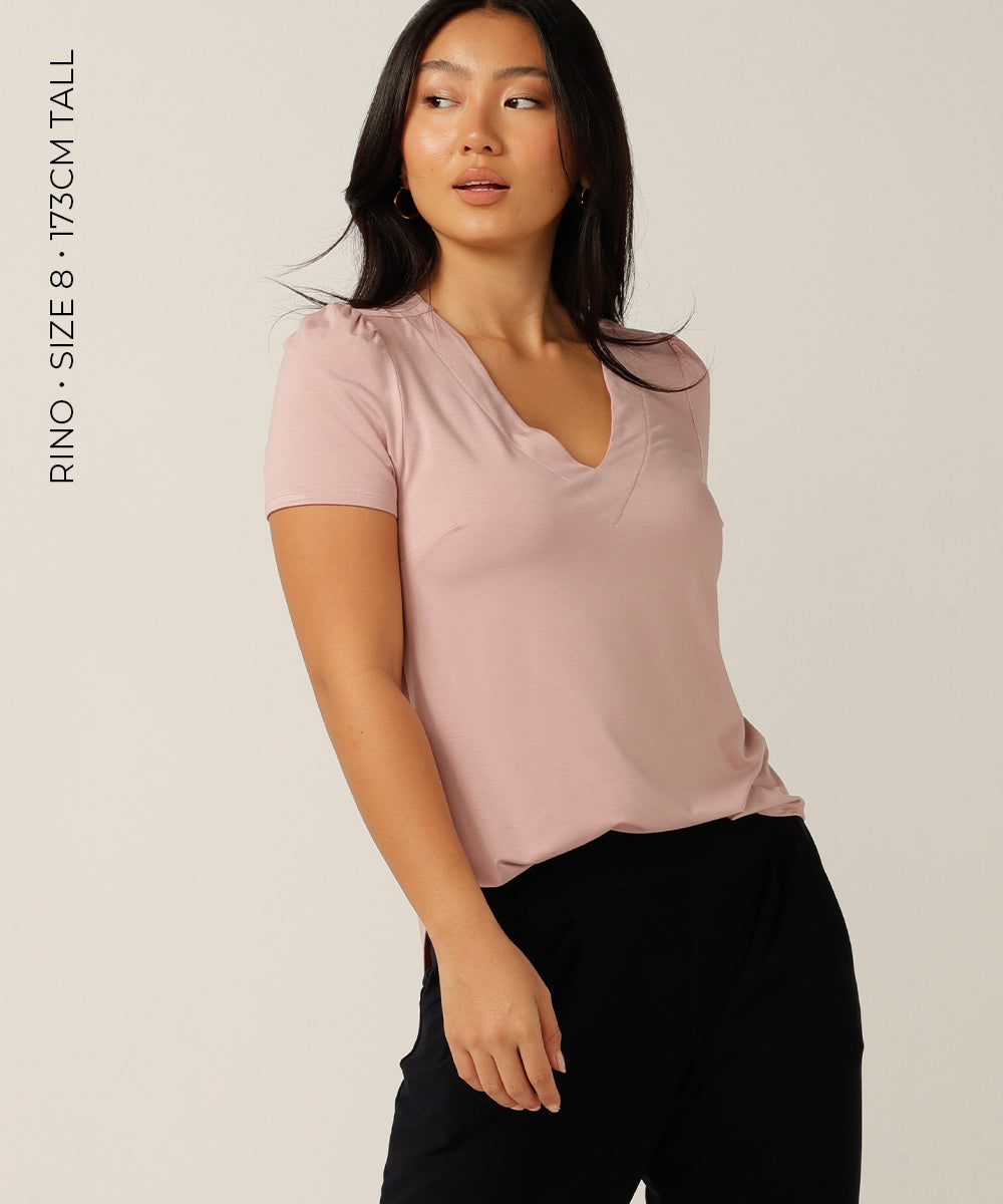 tailored short sleeve top with v-neckline and shirttail hemline