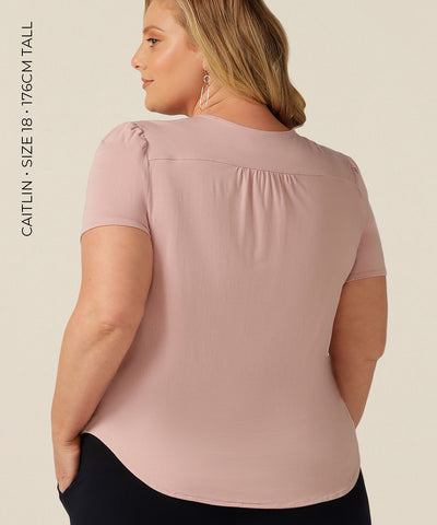 tailored short sleeve top with v-neckline and shirttail hemline