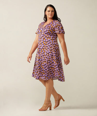 twist front, empire line short dress with flutter sleeve. Made in Australia for plus size women, petite sizes and women looking for evening, occasionwear and party dresses.