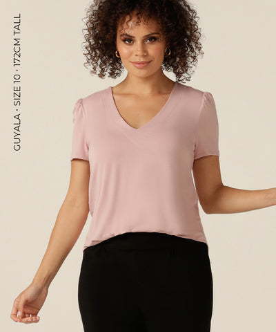 tailored short sleeve top with v-neckline and shirttail hemline